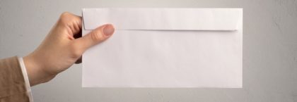 Person holding envelope