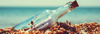 Message in a glass bottle on the beach