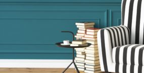 Stripy chair with books next to it