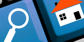 Keyboard with a house and a magnifying glass icon