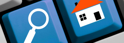 Keyboard with a house and a magnifying glass icon