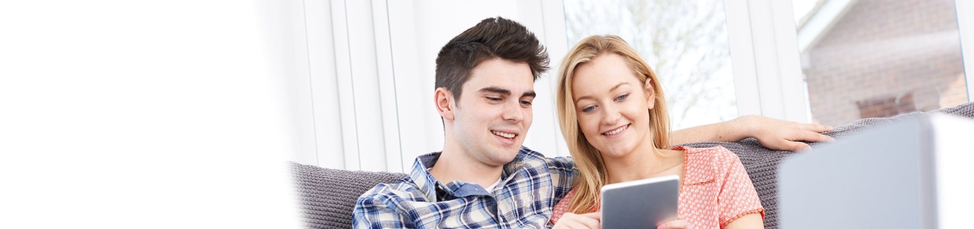 Couple looking Online via a Phone for Rental Property Viewings
