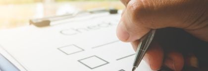 Person signing a checklist