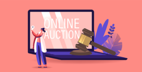 laptop saying online auction with a auctions hammer on the keyboard