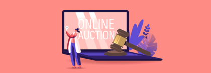 laptop saying online auction with a auctions hammer on the keyboard