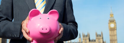 spring-budget-british-politician-holding-classic-pink-piggy