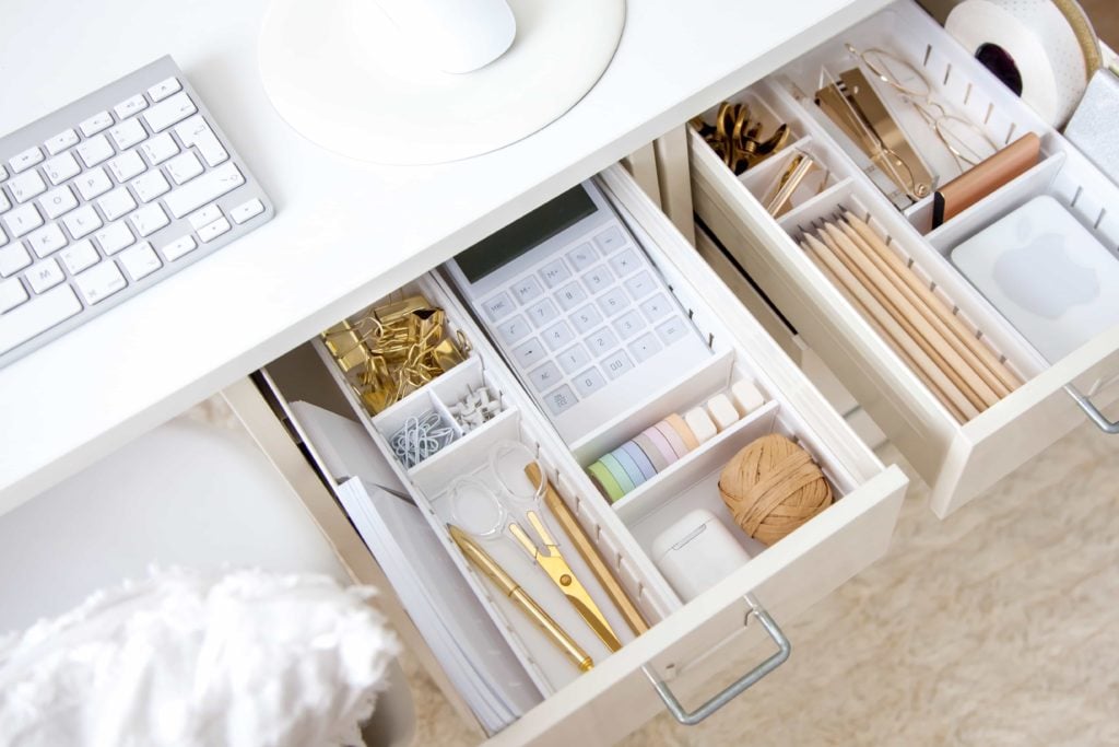White work table. The stylish gold stationery is arranged very neatly in the drawers of the desk. Japanese storage method.
