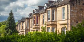 Blonde Sandstone Terraced Homes on a Tree Lined Street in Glasgow Scotland