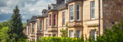 Blonde Sandstone Terraced Homes on a Tree Lined Street in Glasgow Scotland