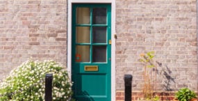 victorian-brick-house-with-colored-doors