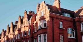 Old red brick houses facades in Kensington, Chelsea, London