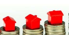 minature-houses-on-coin-stacks-mortgage