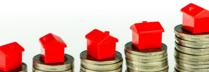 minature-houses-on-coin-stacks-mortgage