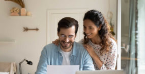 happy-couple-laptop-discussing-35-year-mortgage-2