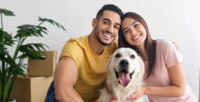 young-couple with-golden-retriever-dog-rental-place